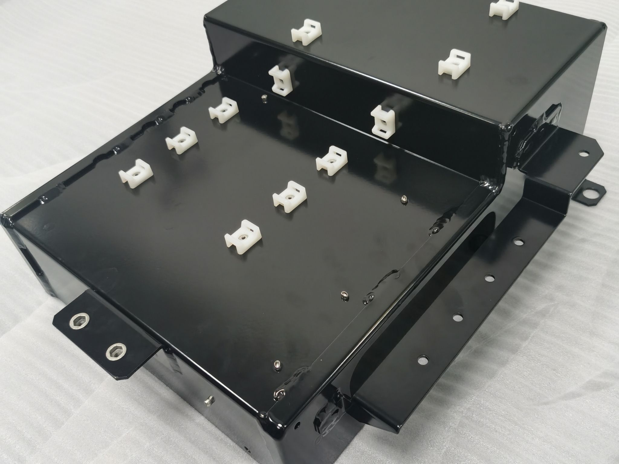 Custom finished sheet metal enclosure with installed clips