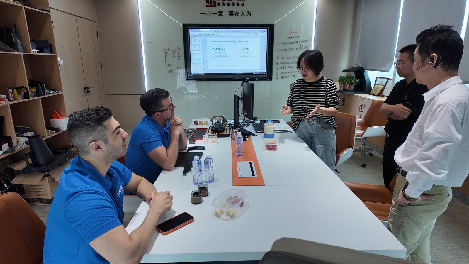 STARWAY key account team discussing enclosure sample appearance and assembly fit requirements with an Australian water purifier customer