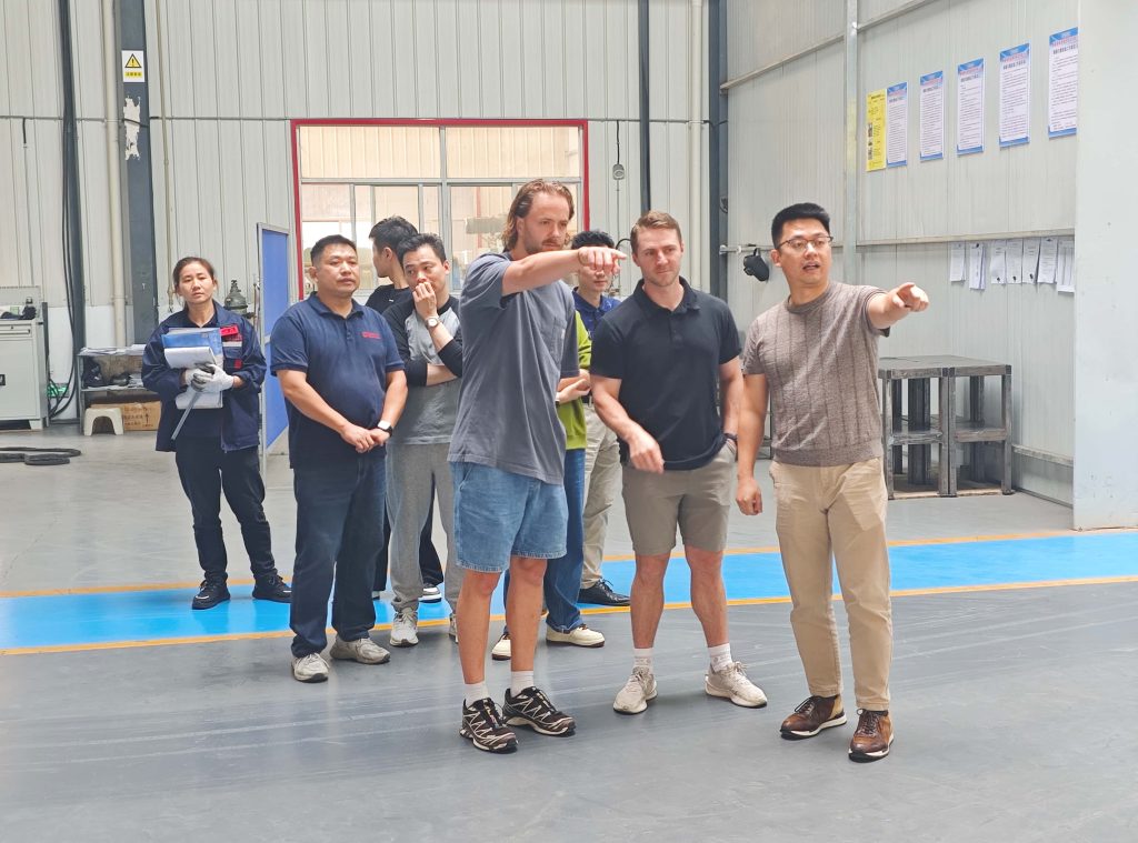 U.S. customer and STARWAY team walking through the sheet metal workshop